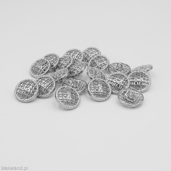 Zdjęcie guzików metalowych, srebrnych. 