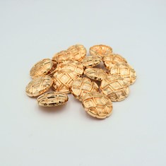 Zdjęcie guzików metalowych w kolorze złota. 